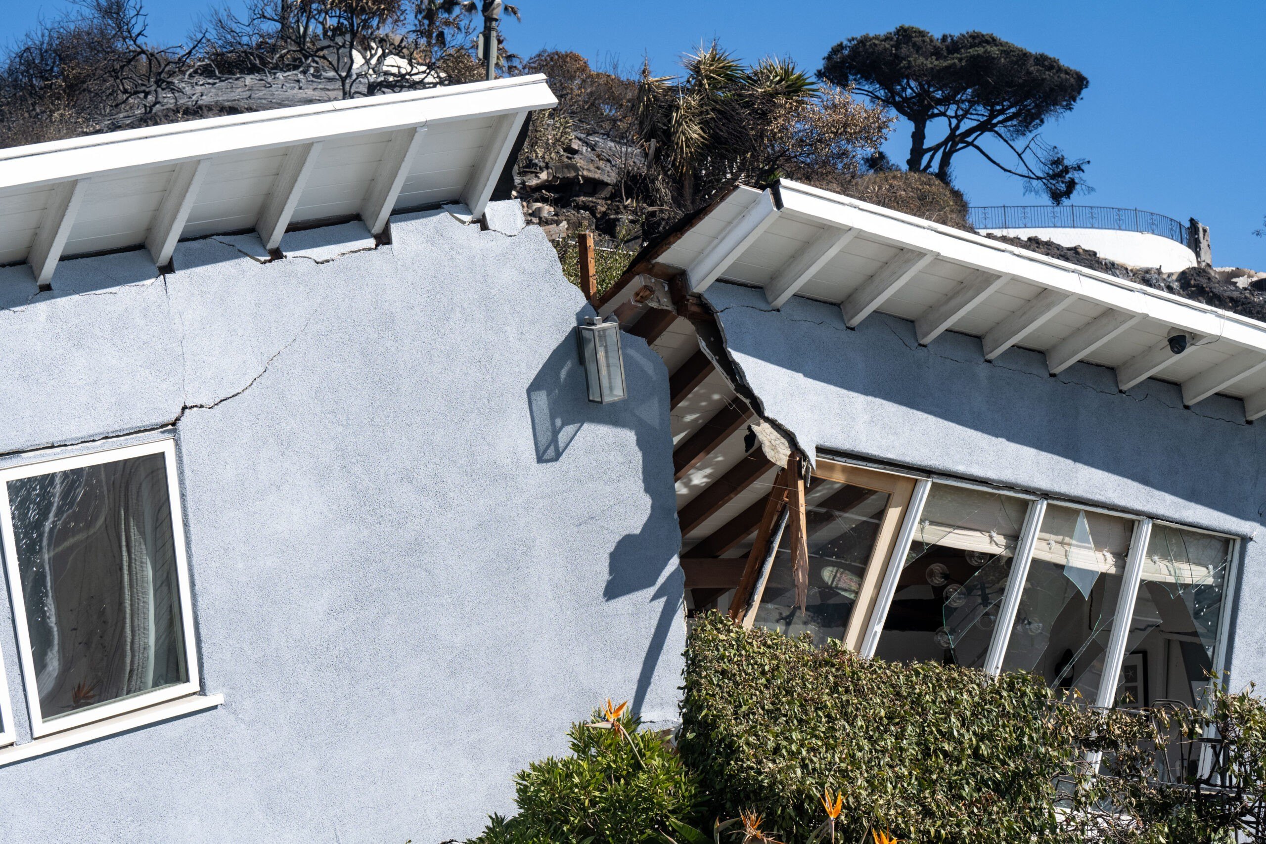 This home in the 17000 block of Castellammare Drive near Stretto Way, which survived damage from the Palisades Fire, was split in half by a landslide