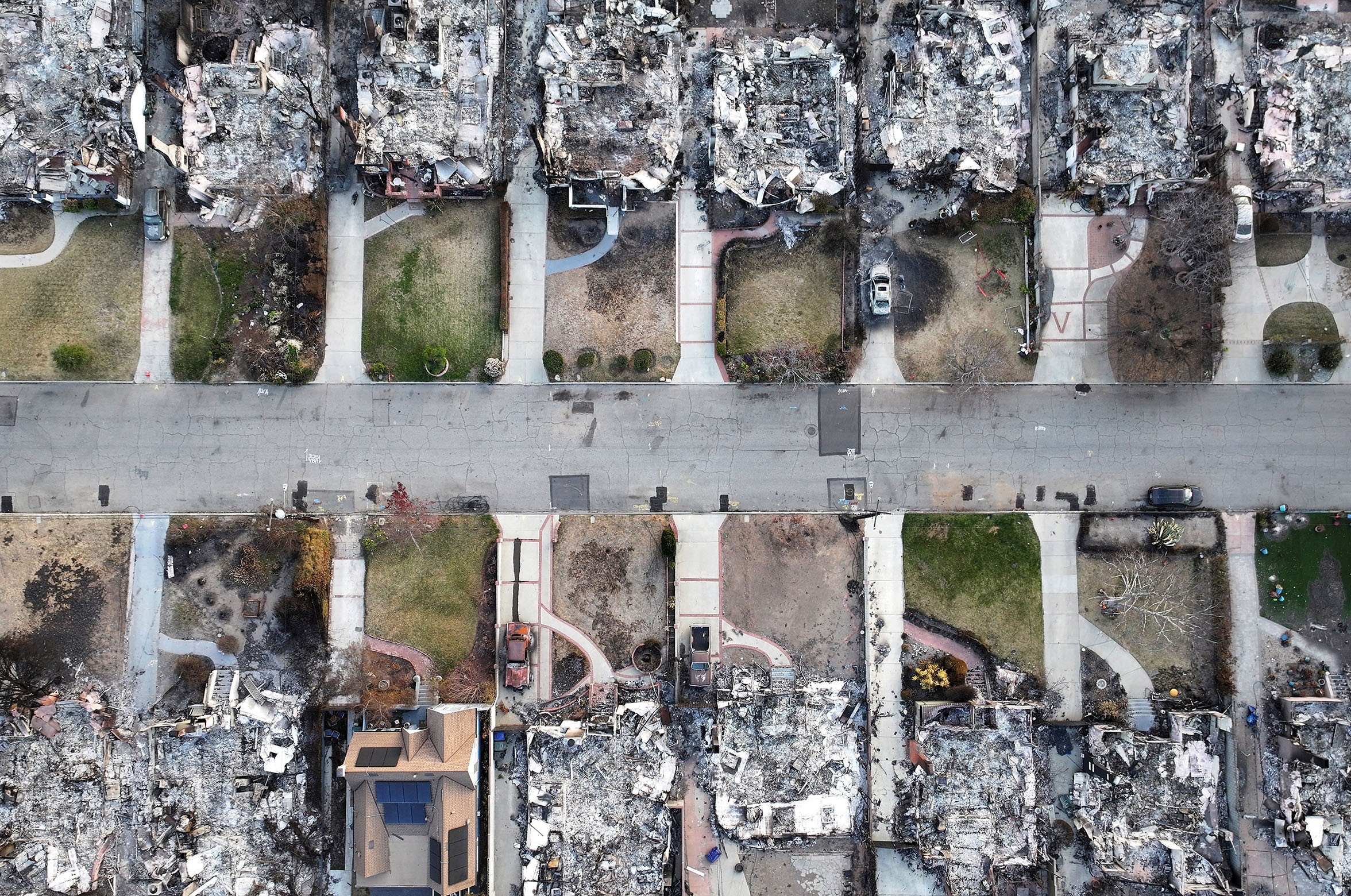 An aerial view of homes which burned in the Eaton Fire near one home which survived on January 21, 2025 in Altadena, California.