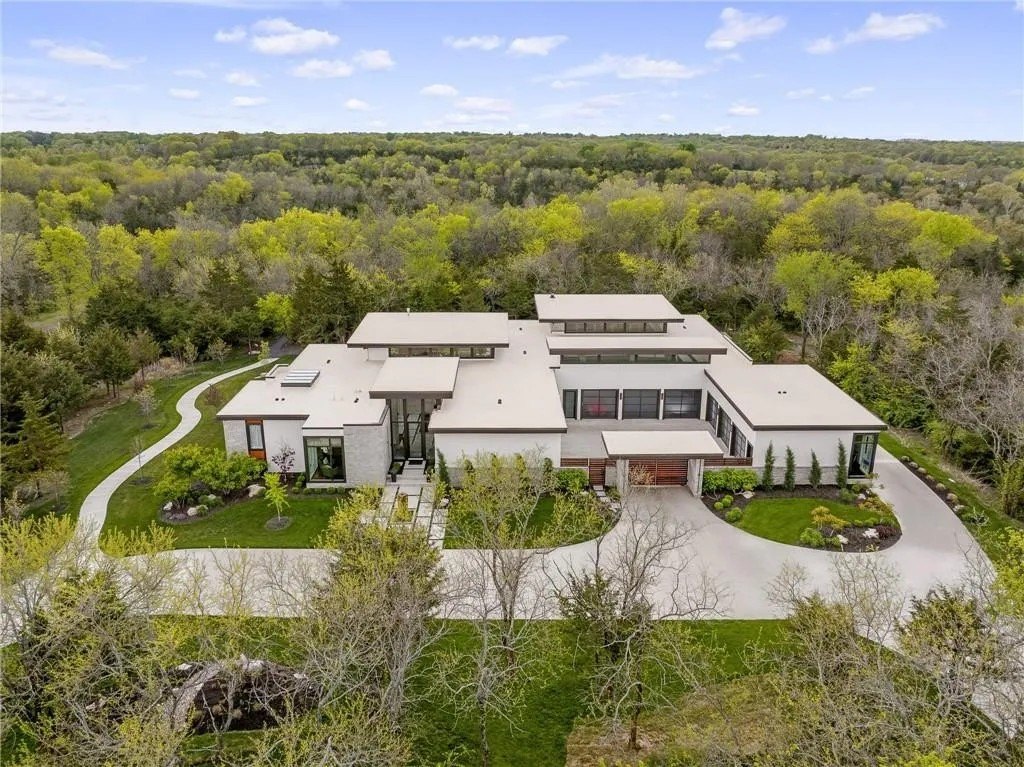 This beautiful modern spread near Kansas City sprawls over 10.34 acres, and contains 9,845 square feet of luxe living space.