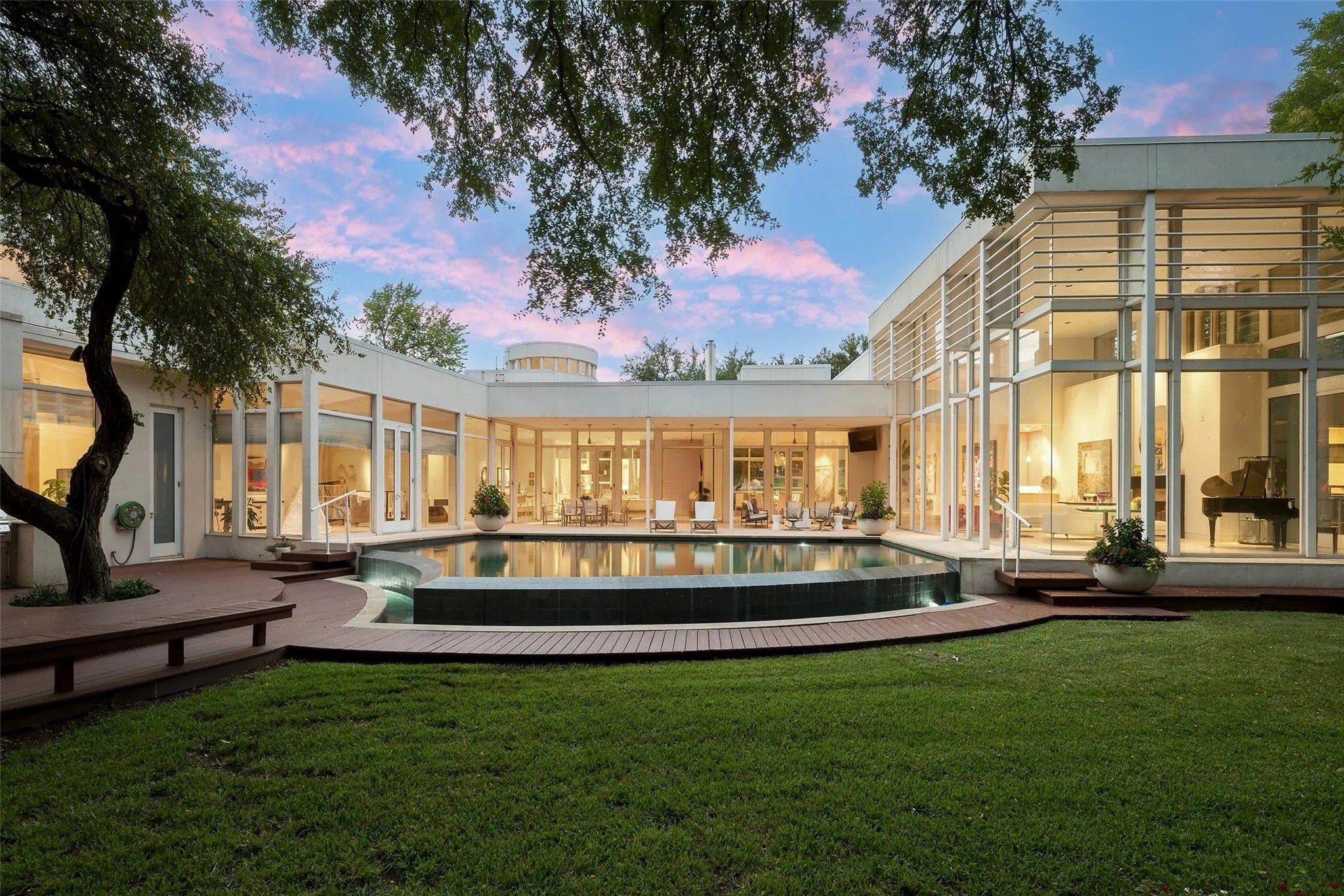 This Dallas mansion features five bedrooms and eight bathrooms in 8,984 square feet of light-filled living space, on a lush, green 3.38 acre lot.