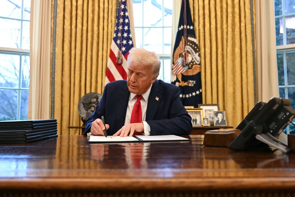 US President Donald Trump signs an executive order