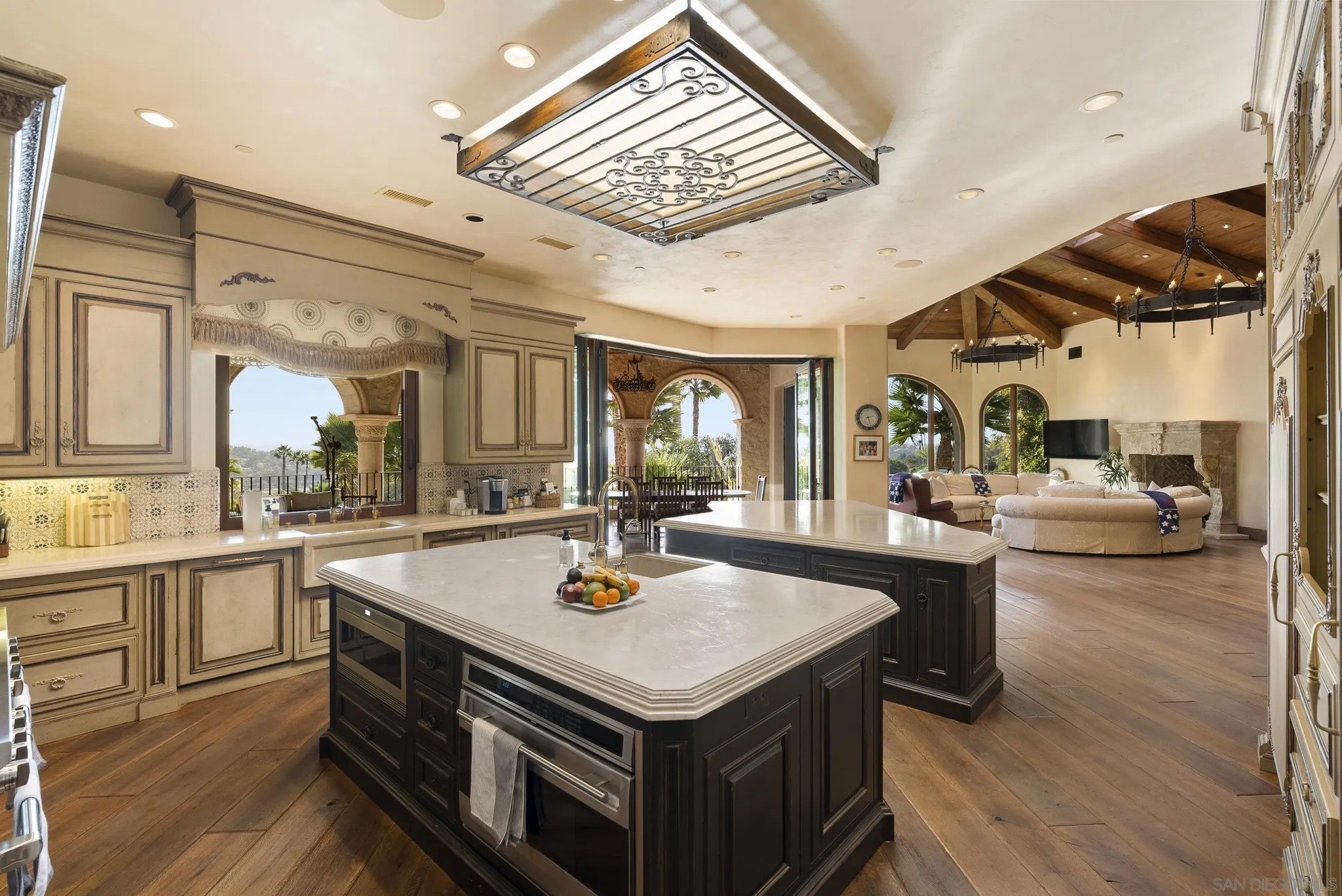 The ornate kitchen offers double islands.