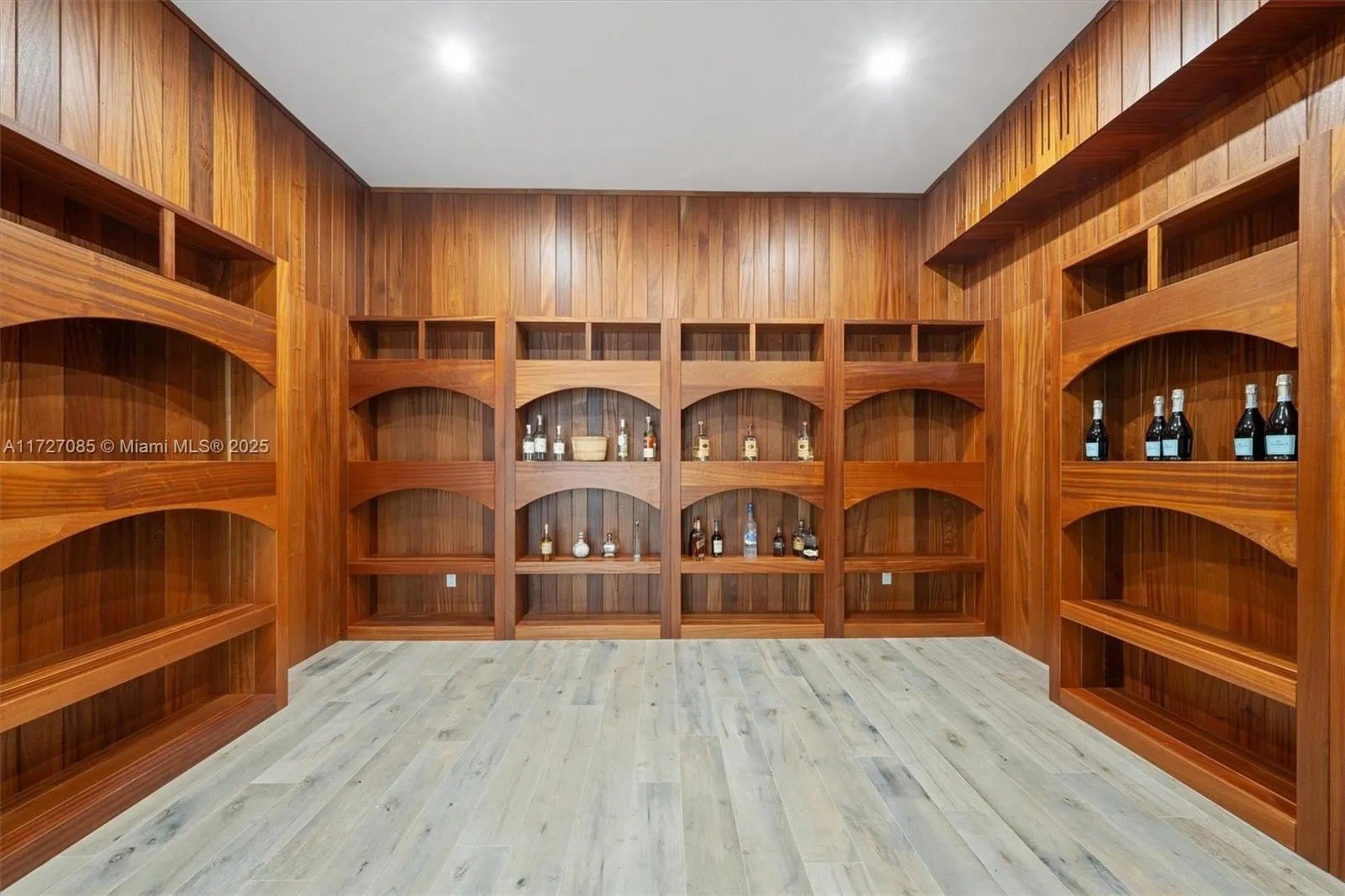 wood shelves with wine in a large room