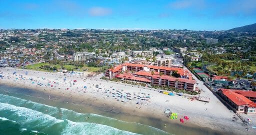 An aerial view of the hotel with people crawling all over the front