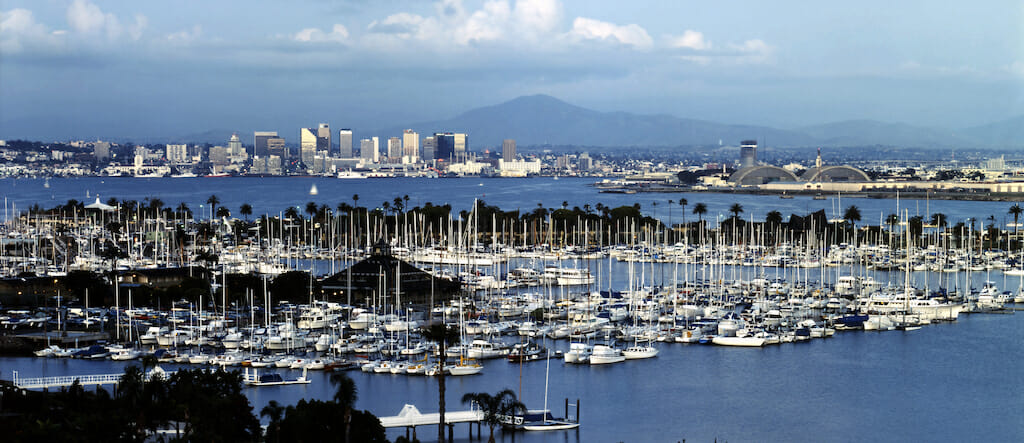 Boats cluster around the shores of Shelter Island on a beautiful sunny day in San Diego