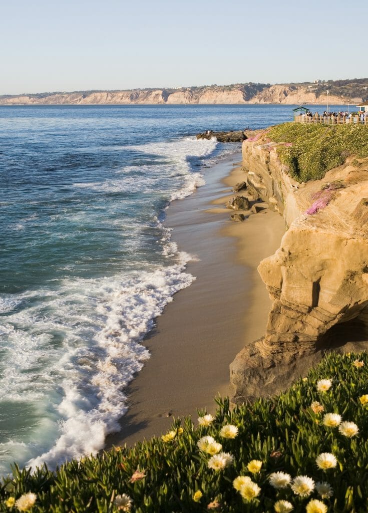 Beautiful cliffs, rocks, beach, and Pacific Ocean in La Jolla California in the late evening