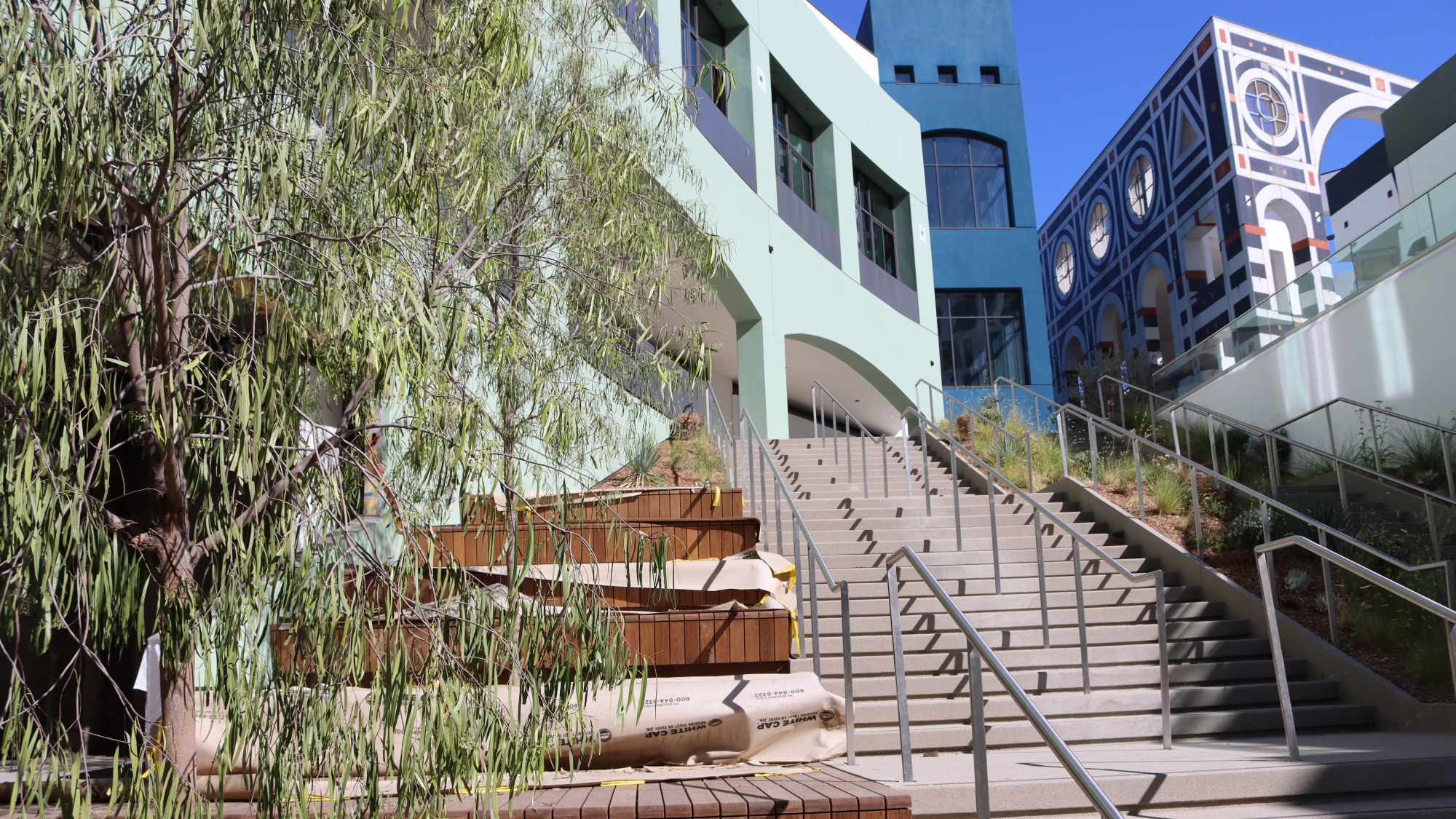 Stockdale Capital Partners has said it intends to open some retail storefronts at the long-awaited Campus at Horton in downtown San Diego in the fall. The green building, pictured center left, is building 200, where Sprouts, Studio Three and SunLife Organics will occupy the first and second floors. The five-story building also features three floors of office space.(Stockdale Capital Partners, LLC)