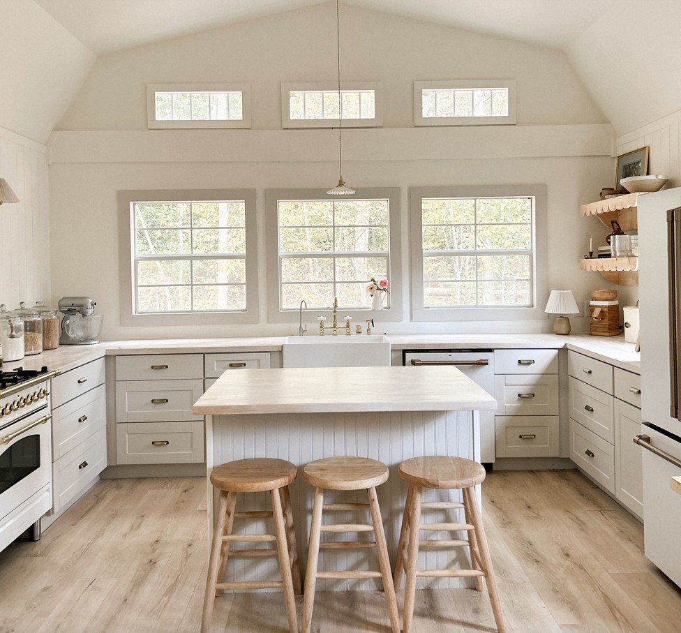Eliminating the loft over the kitchen and raising the ceiling gave the room a more expansive feeling.