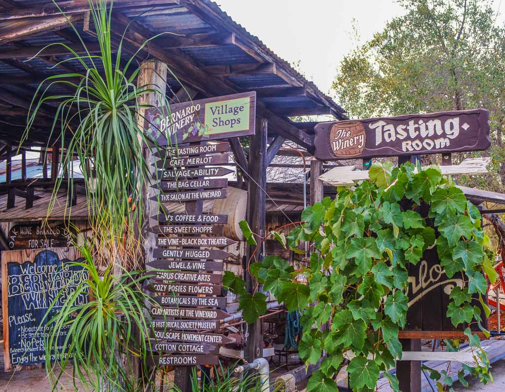 Bernardo Winery Tasting room with lots of rustic wood signs and lush greens