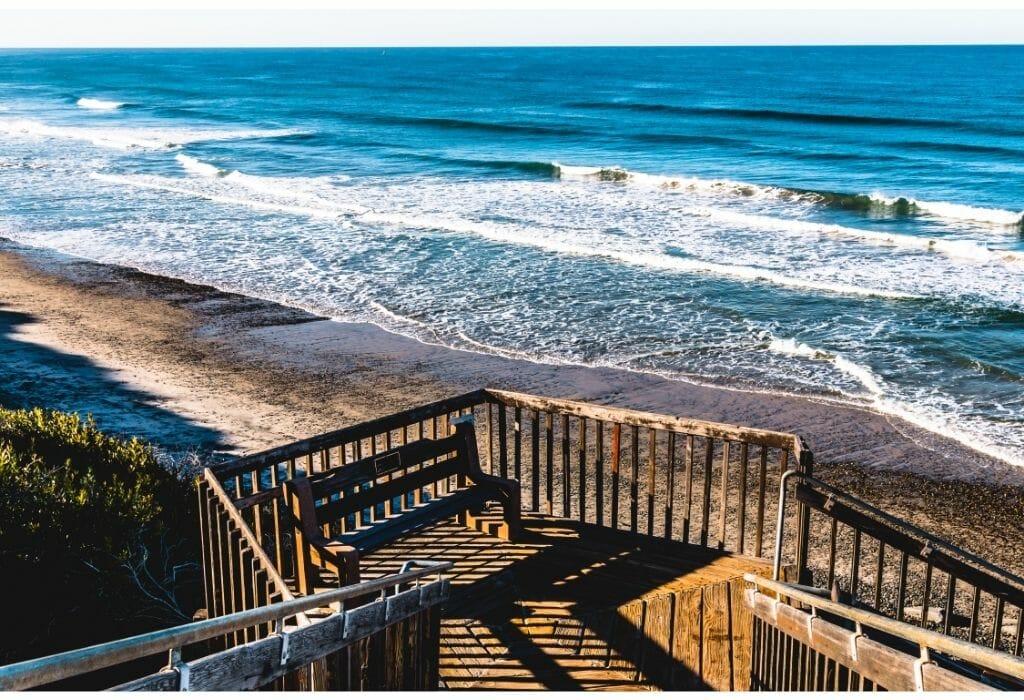 wooden stairs leading from the coastal bluffs down to the beach at Carlsbad State Beach