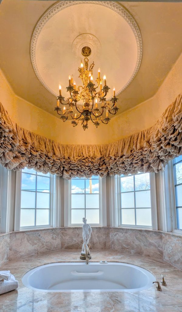 Bathtub with chandelier at The Genevieve Hotel Santa Ynez