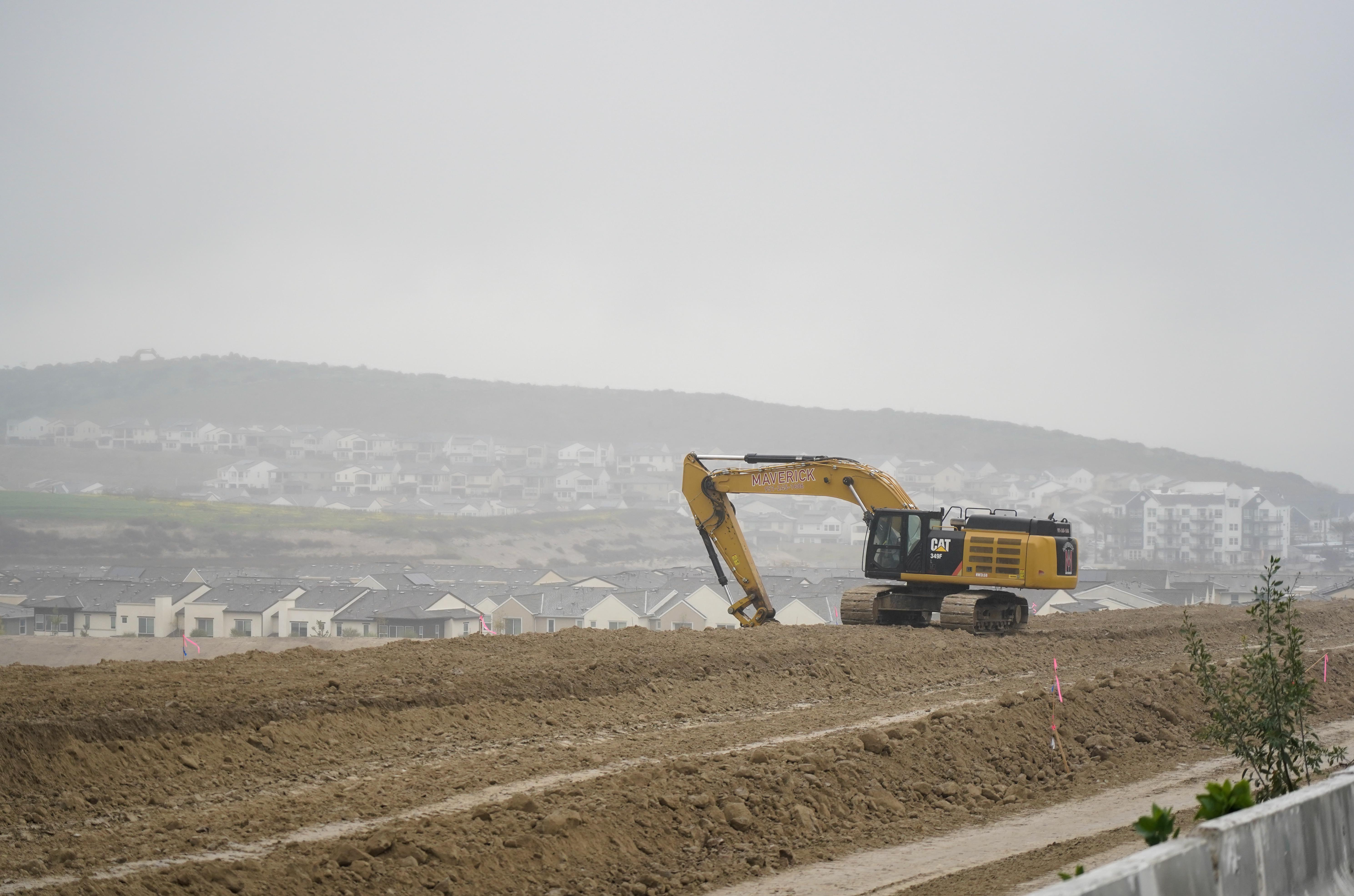 Crews work to prepare land Monday for an additional 3,000...