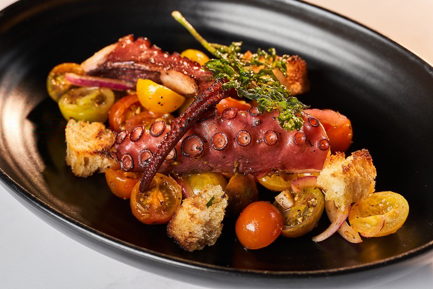 San Diego steakhouse STK offering a special seafood menu called Bounty of the Seven Seas featuring grilled octopus