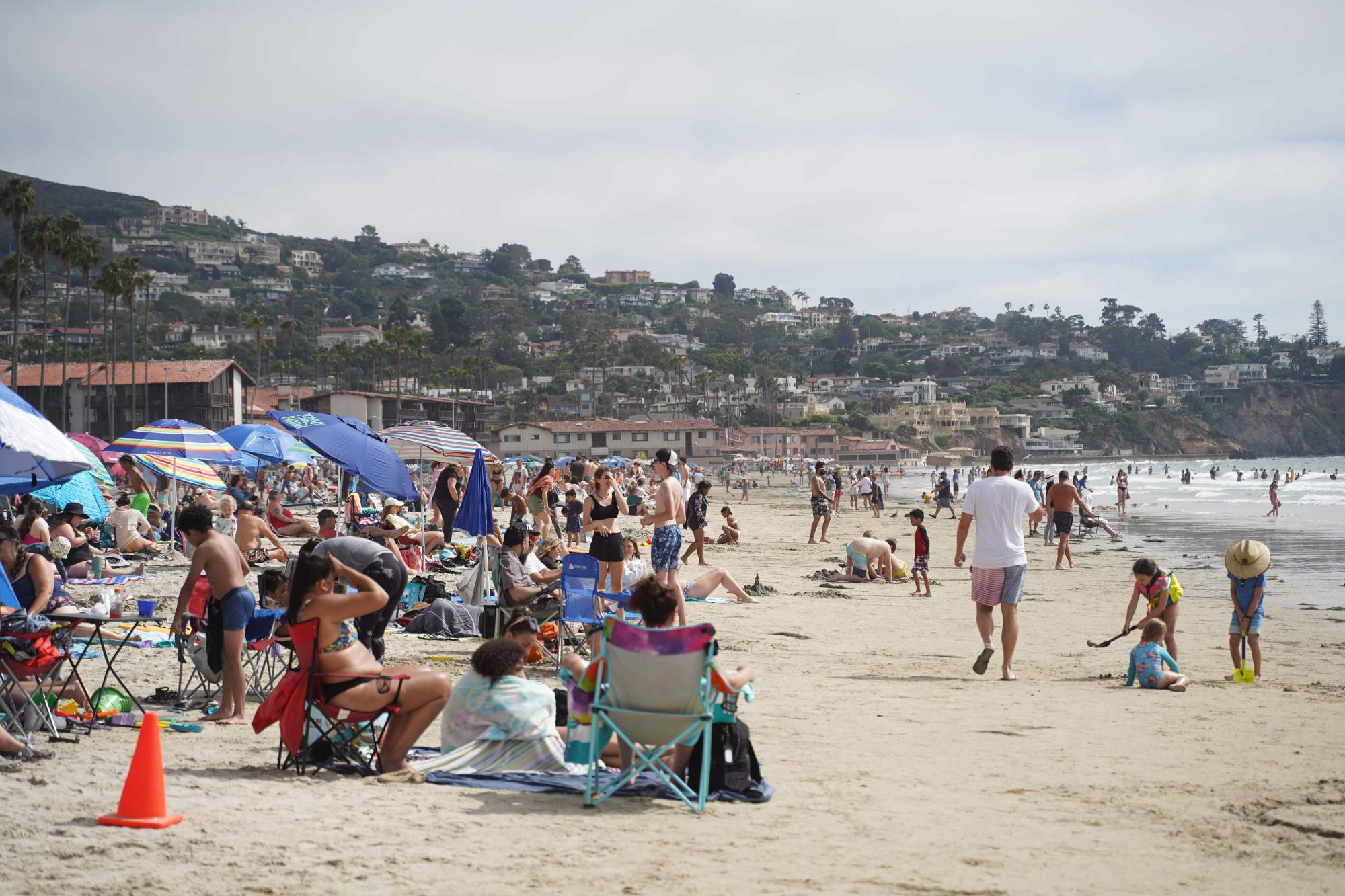 People have fun at the La Jolla Shores Beach in early July. (Michael Ho / The San Diego Union-Tribune)