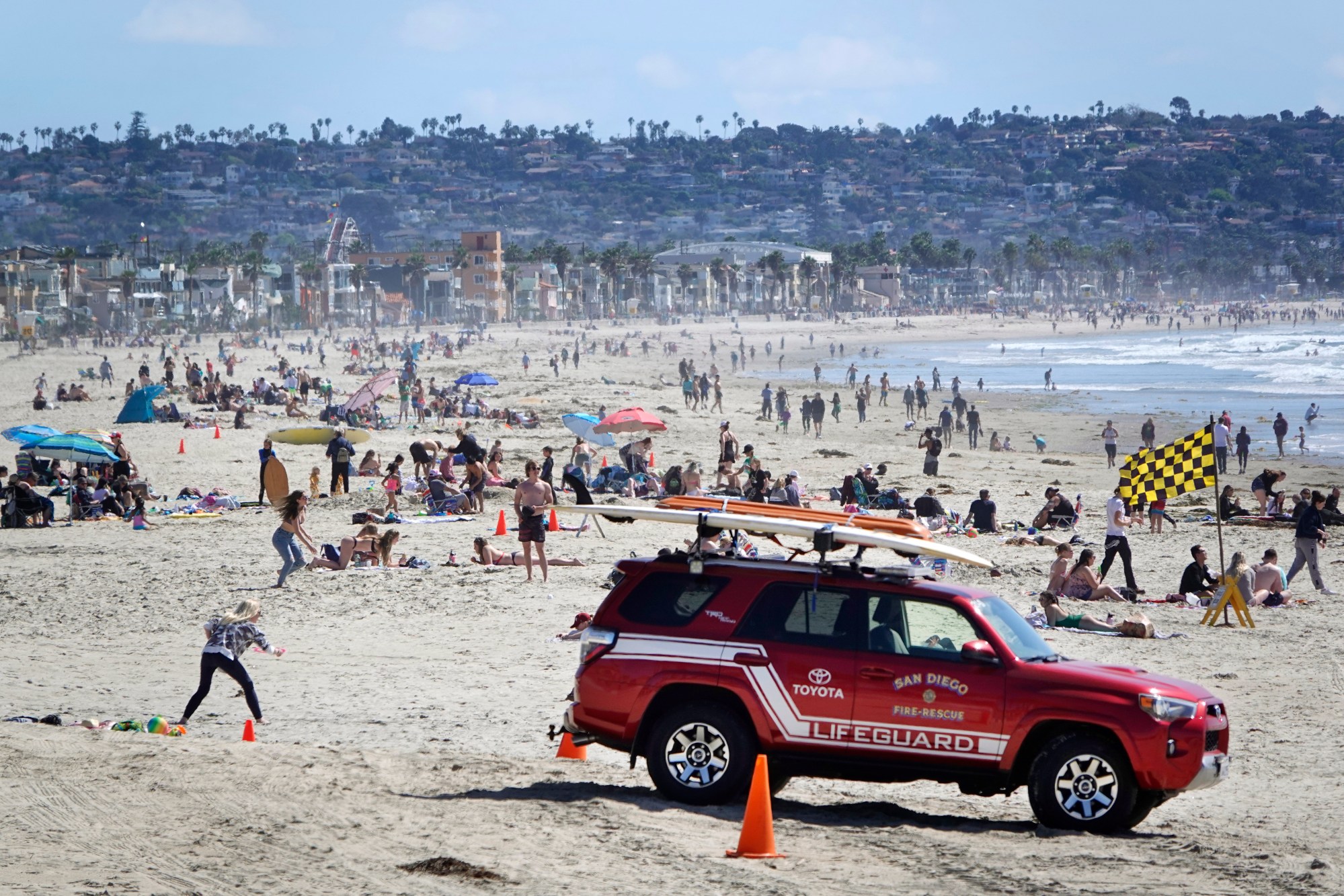Beachgoers enjoy a sunny day in Pacific Beach. The Central Coast submarket has an average monthly rent rate of $2,421, (K.C. Alfred / The San Diego Union-Tribune)