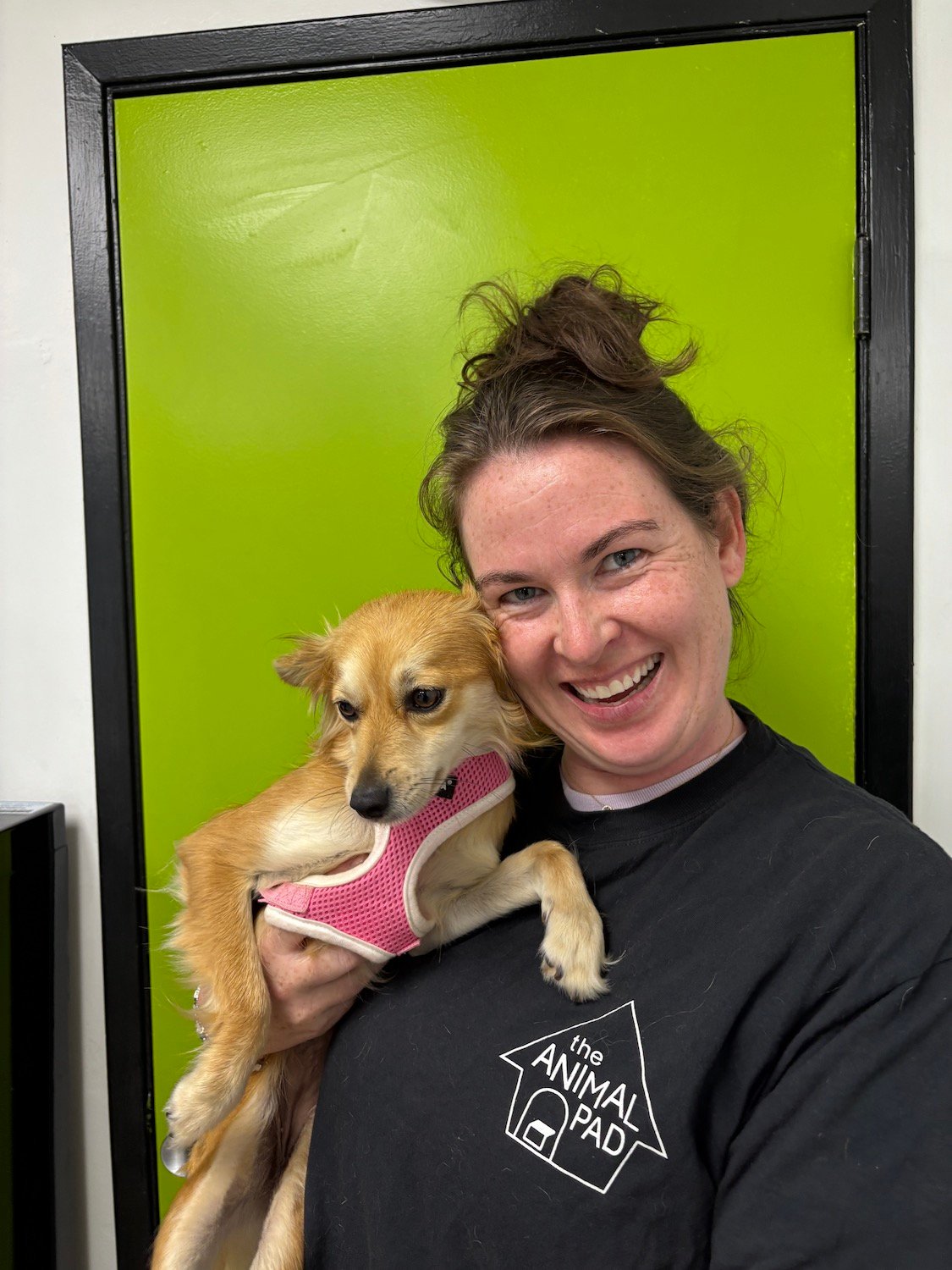 San Diego nonprofit The Animal Pad featuring volunteer Sam Clancy holding her adopted dog