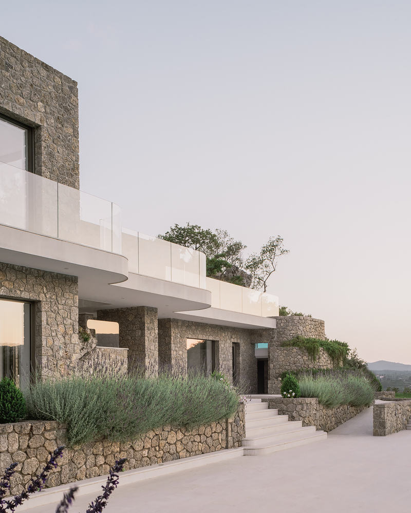 Corfu House Stone curved glass balcony