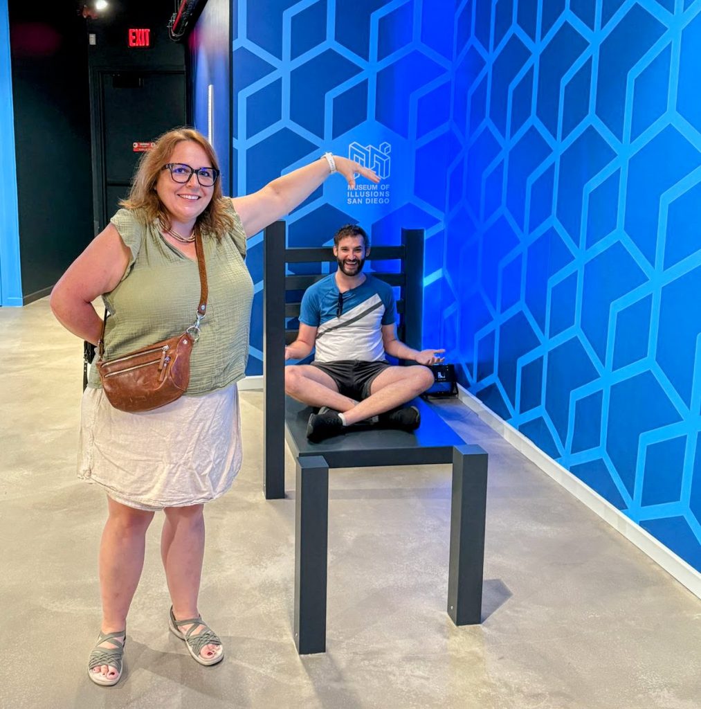 Andrew Stilman and Maria Haase at the Museum of Illusions San Diego with a mindbending chair illusion