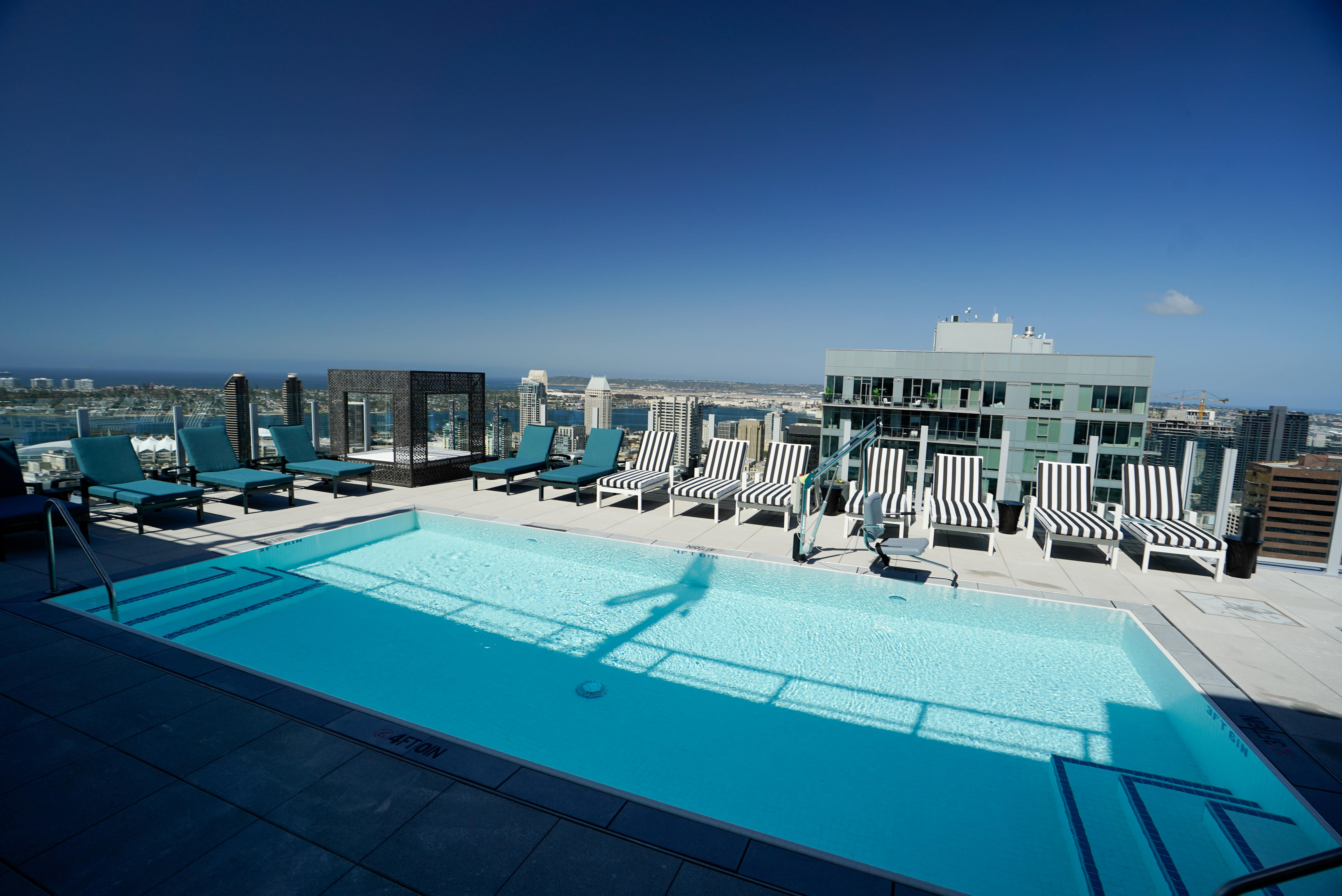 Lounge chairs and a cabana around the pool on the...