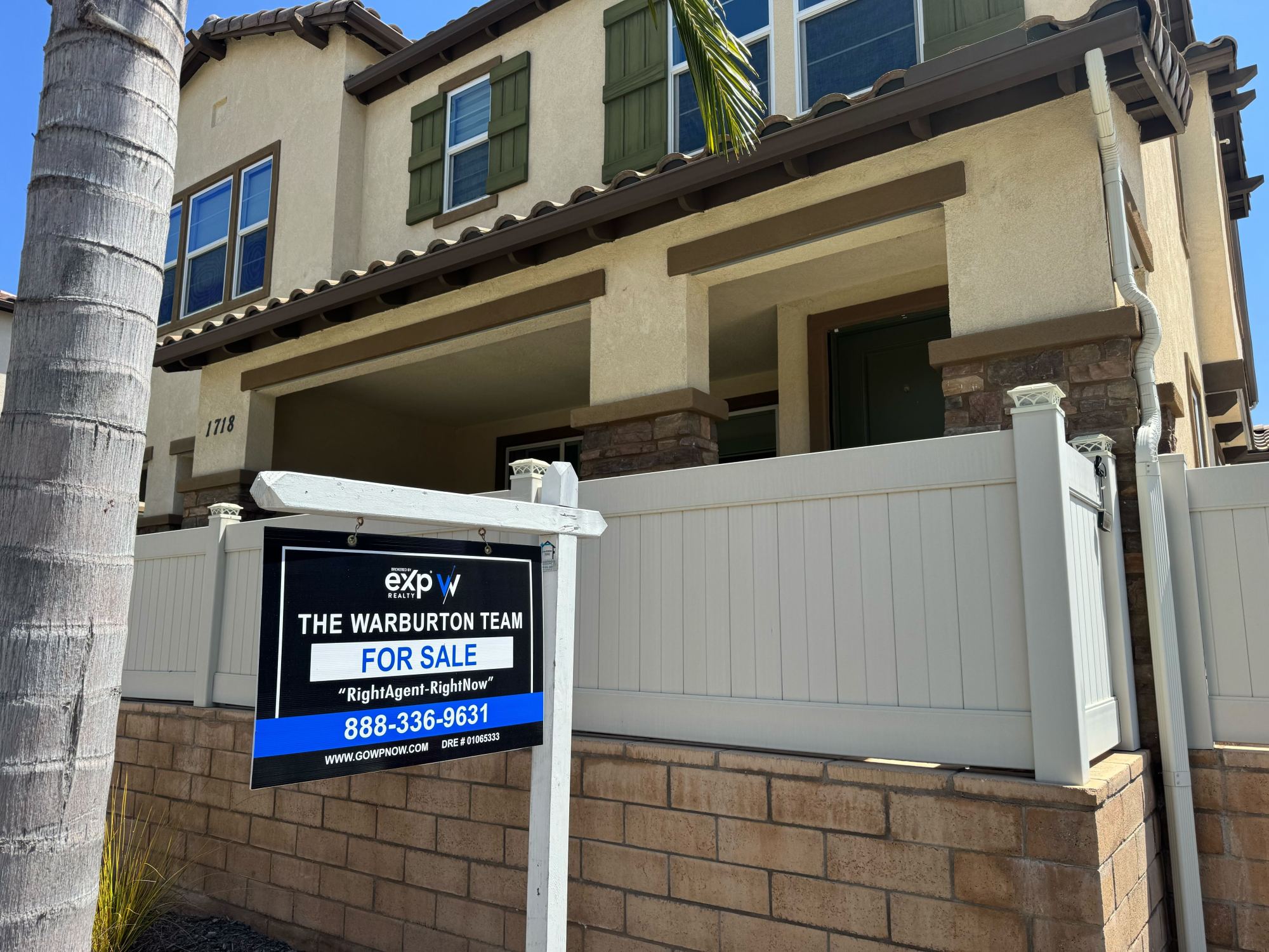A for sale sign hangs outside a townhouse in Chula Vista listed for $670,000 in mid-May. The 1,583-square-foot home on Signature Place has two bedrooms and two and a half bathrooms. (Phillip Molnar/The San Diego Union-Tribune)