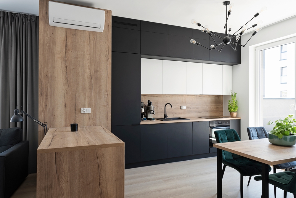 modern kitchen with wood countertops and black accents