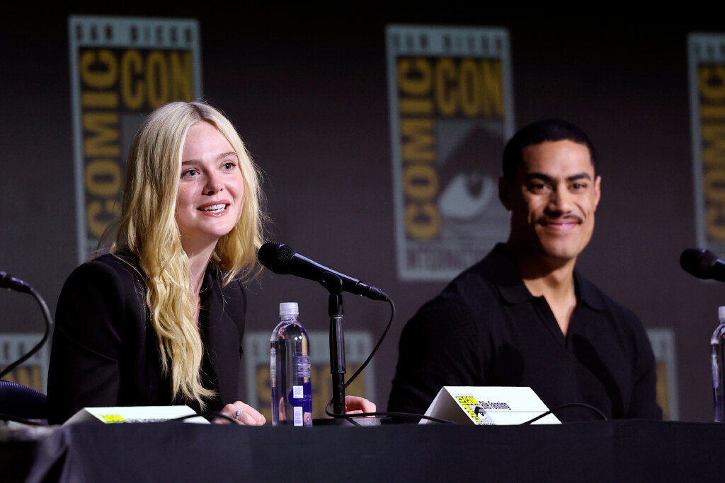 Elle Fanning and Dimitrius Schuster-Koloamatangi speak onstage at 20th Century Fox's "Predator: Badlands" Panel" during 2025 Comic-Con International: San Diego at San Diego Convention Center on July 25, 2025 in San Diego, California. (Photo by Amy Sussman/Getty Images)