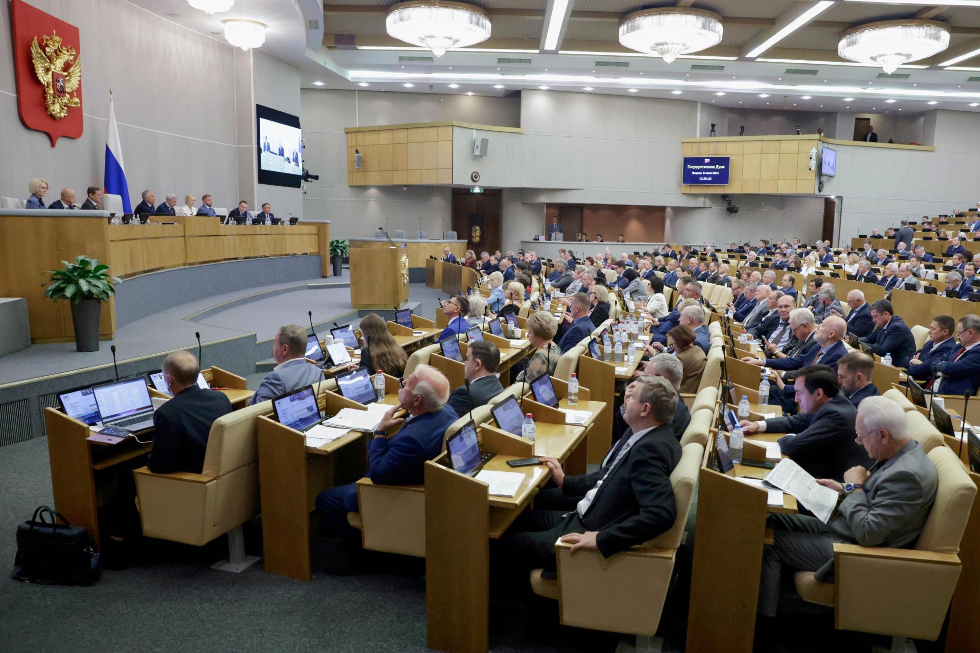 In this photo released by the State Duma, deputies attend a session at the State Duma, the lower house of the Russian parliament, in Moscow, Russia, Tuesday, July 22, 2025. (The State Duma, Lower House of the Russian Parliament Press Service via AP)