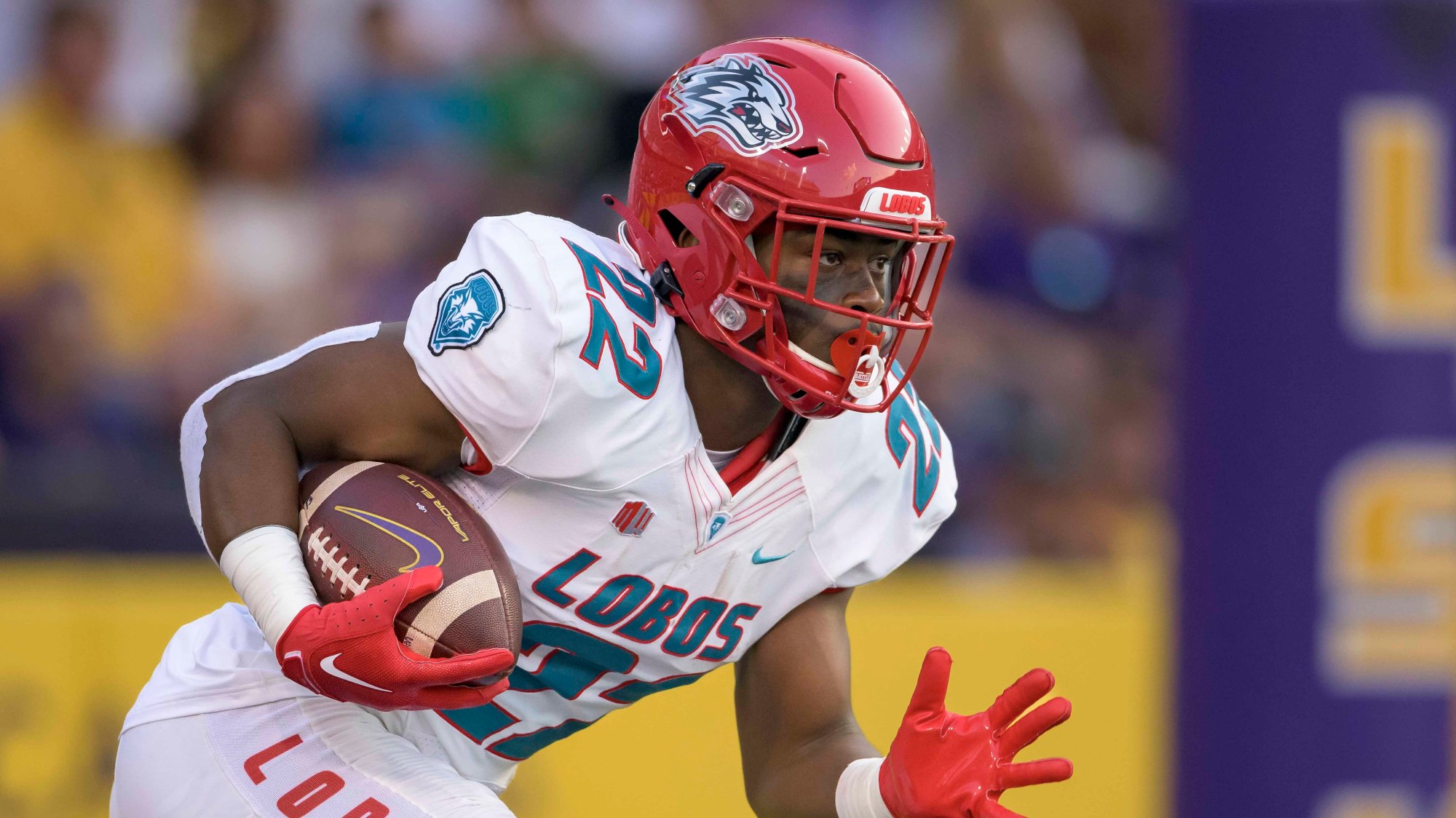 New Mexico running back Christian Washington (22) runs during the first half an NCAA football game against LSU on Saturday, Sept. 24, 2022, in New Orleans. (AP Photo/Matthew Hinton)