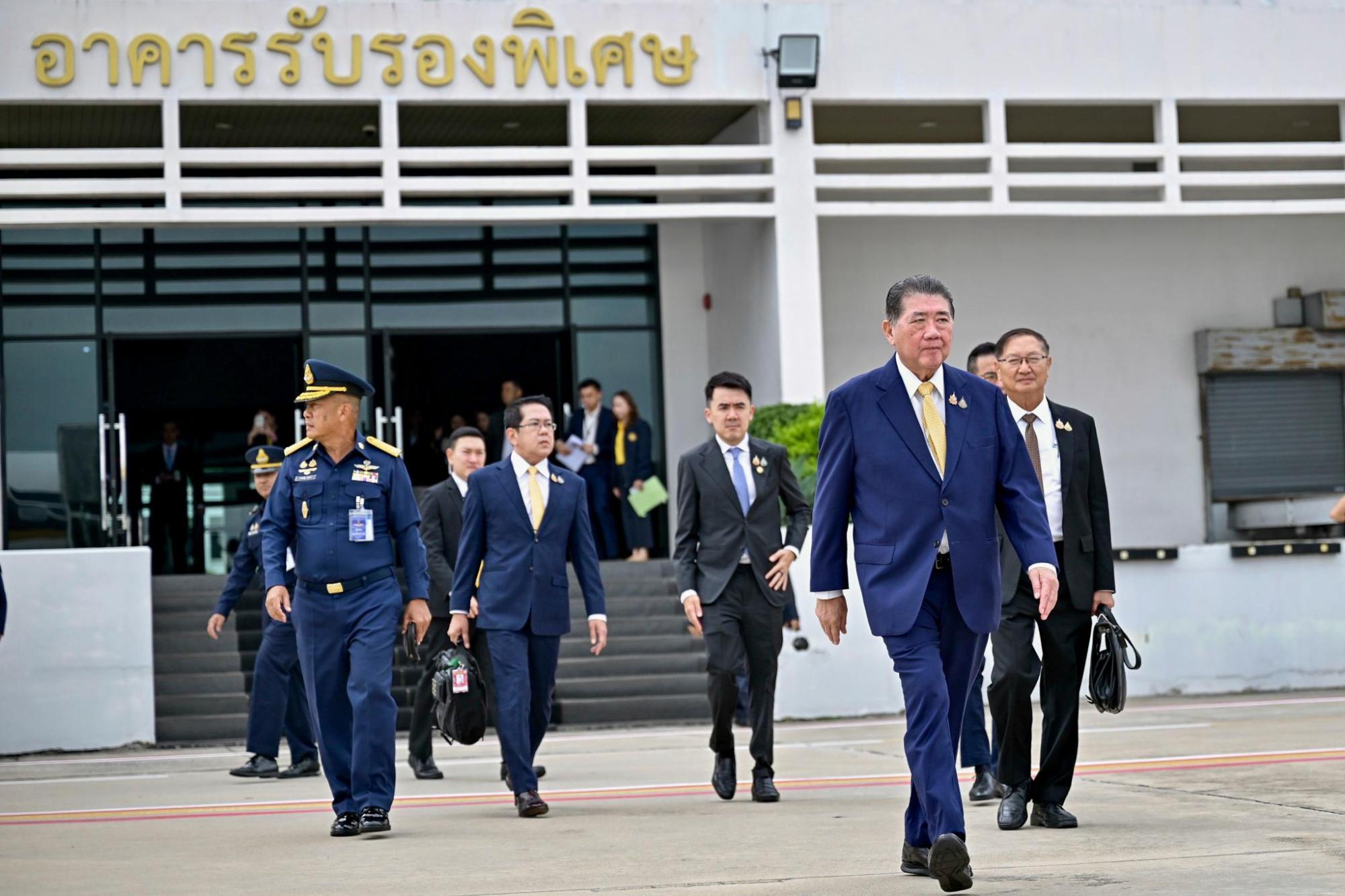 Thailand's acting Prime Minister Phumtham Wechayachai, front, departs from Military Airport in Bangkok, to Malaysia, to attend a meeting to discuss regional peace