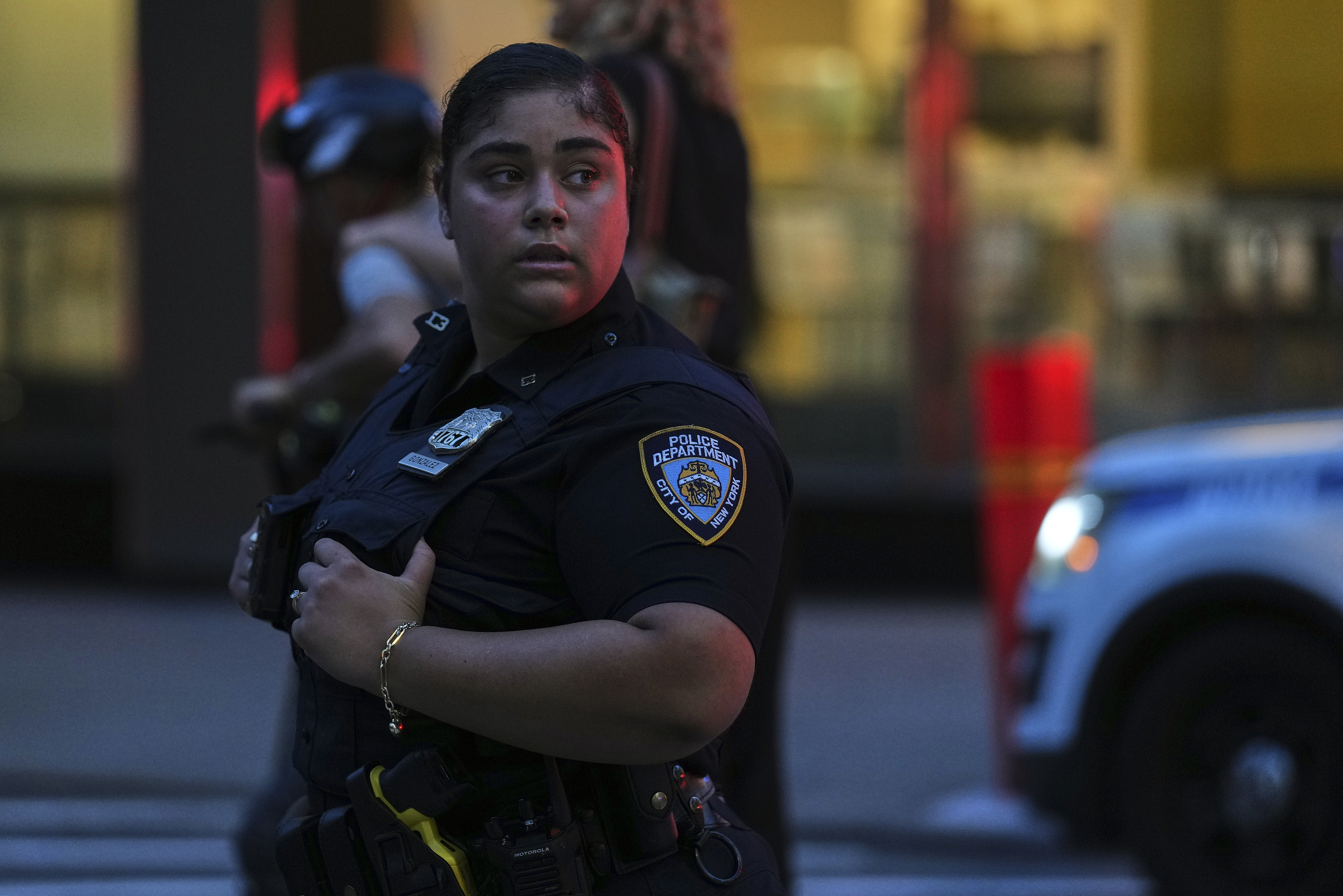 A New York Police officer stands watch at the scene...