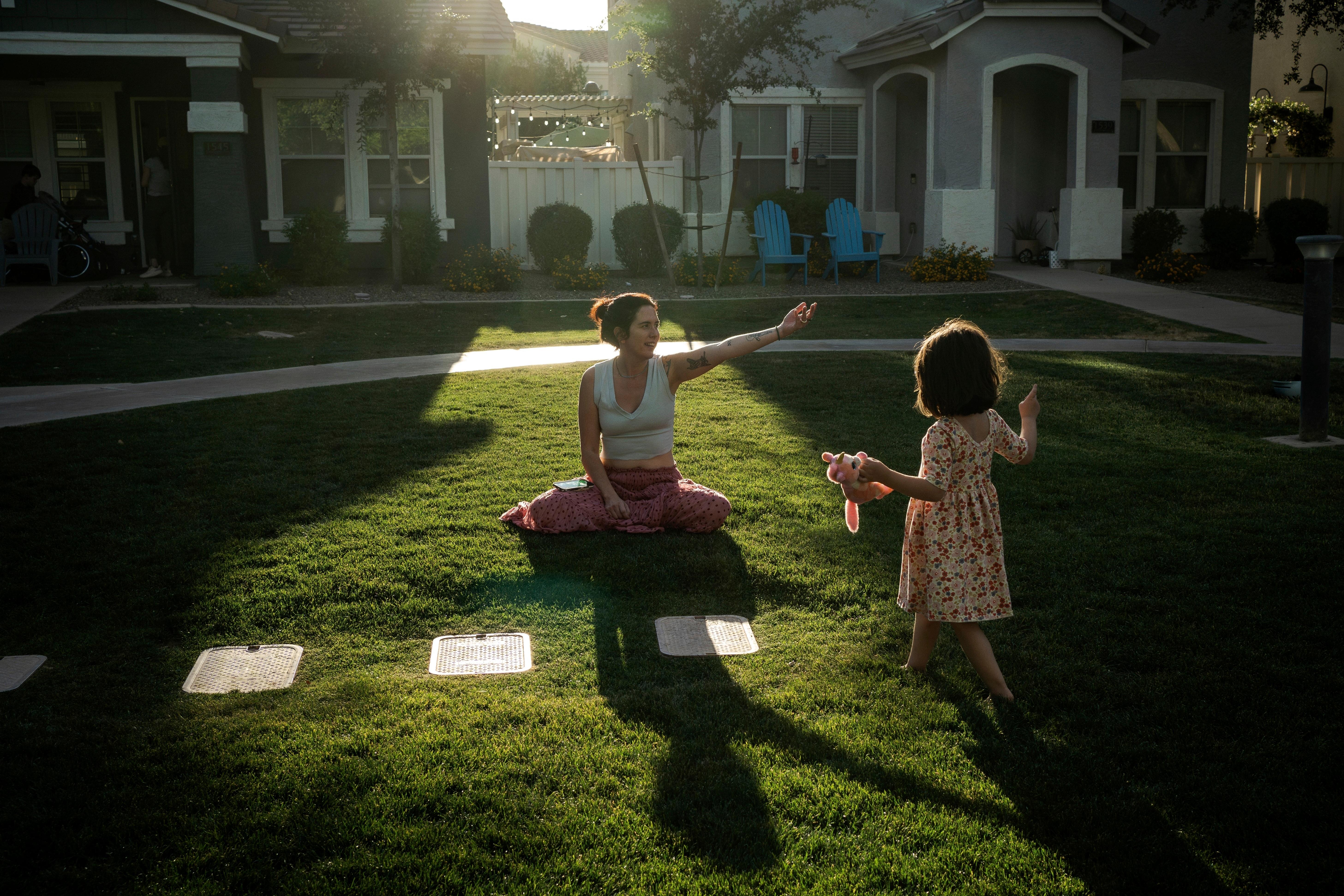 Maria Padron, center, plays with her daughter Fae Padron, 4,...