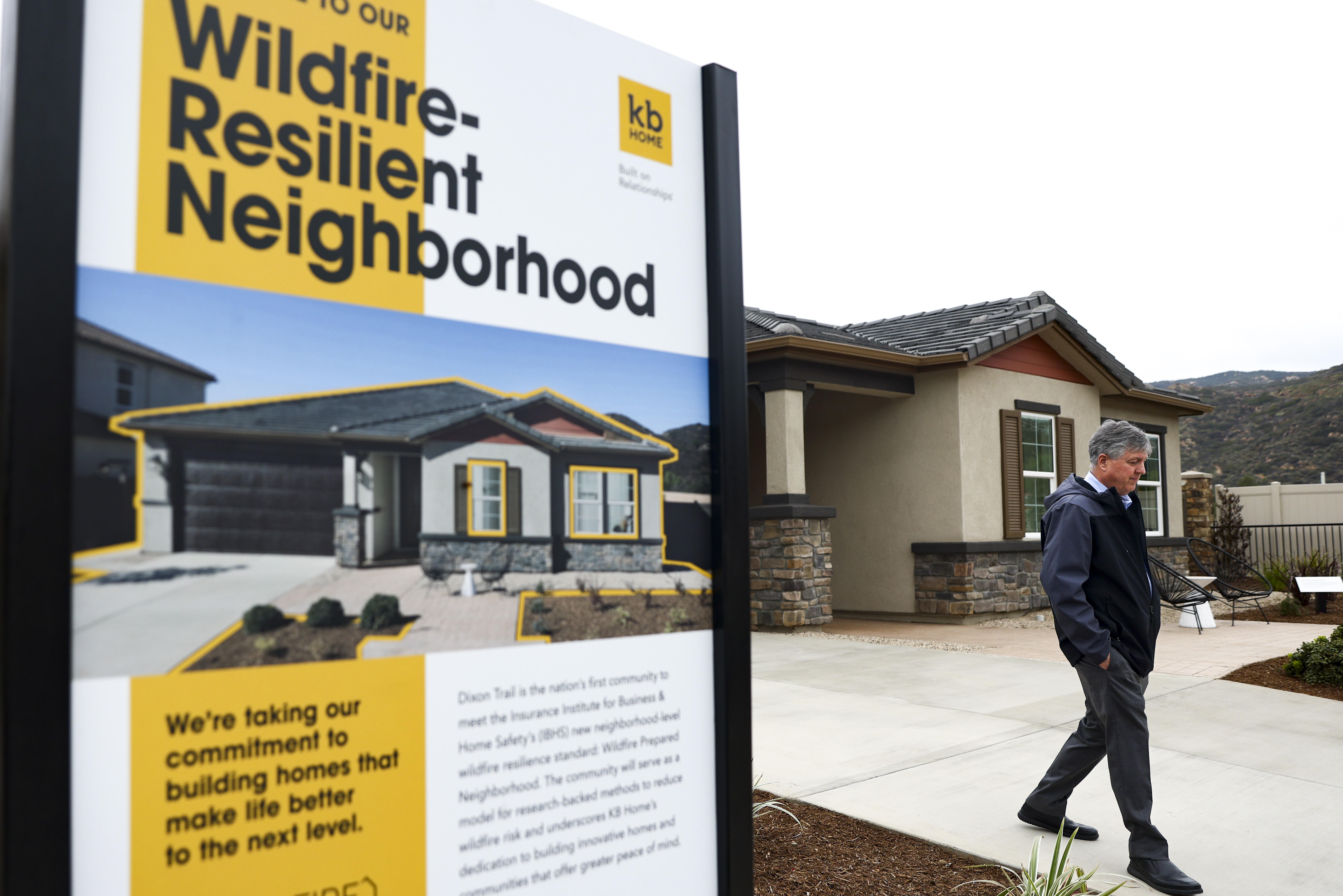 Steve Ruffner, president of KB Home Coastal, walks down the...