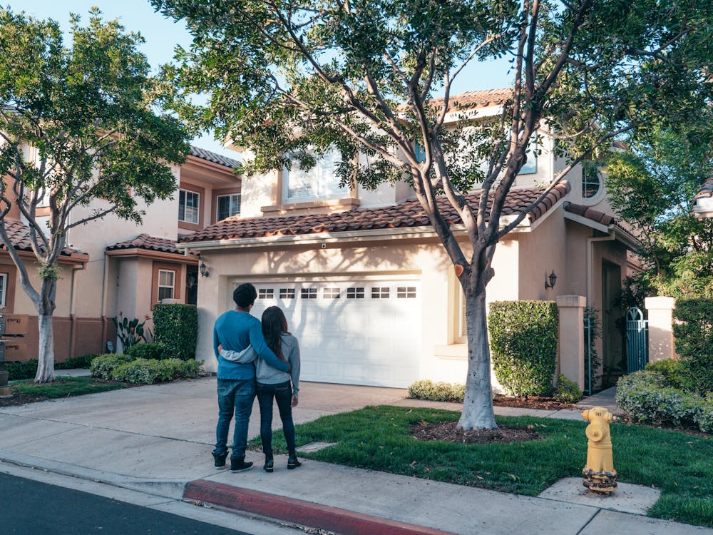 Couple Standing of their house