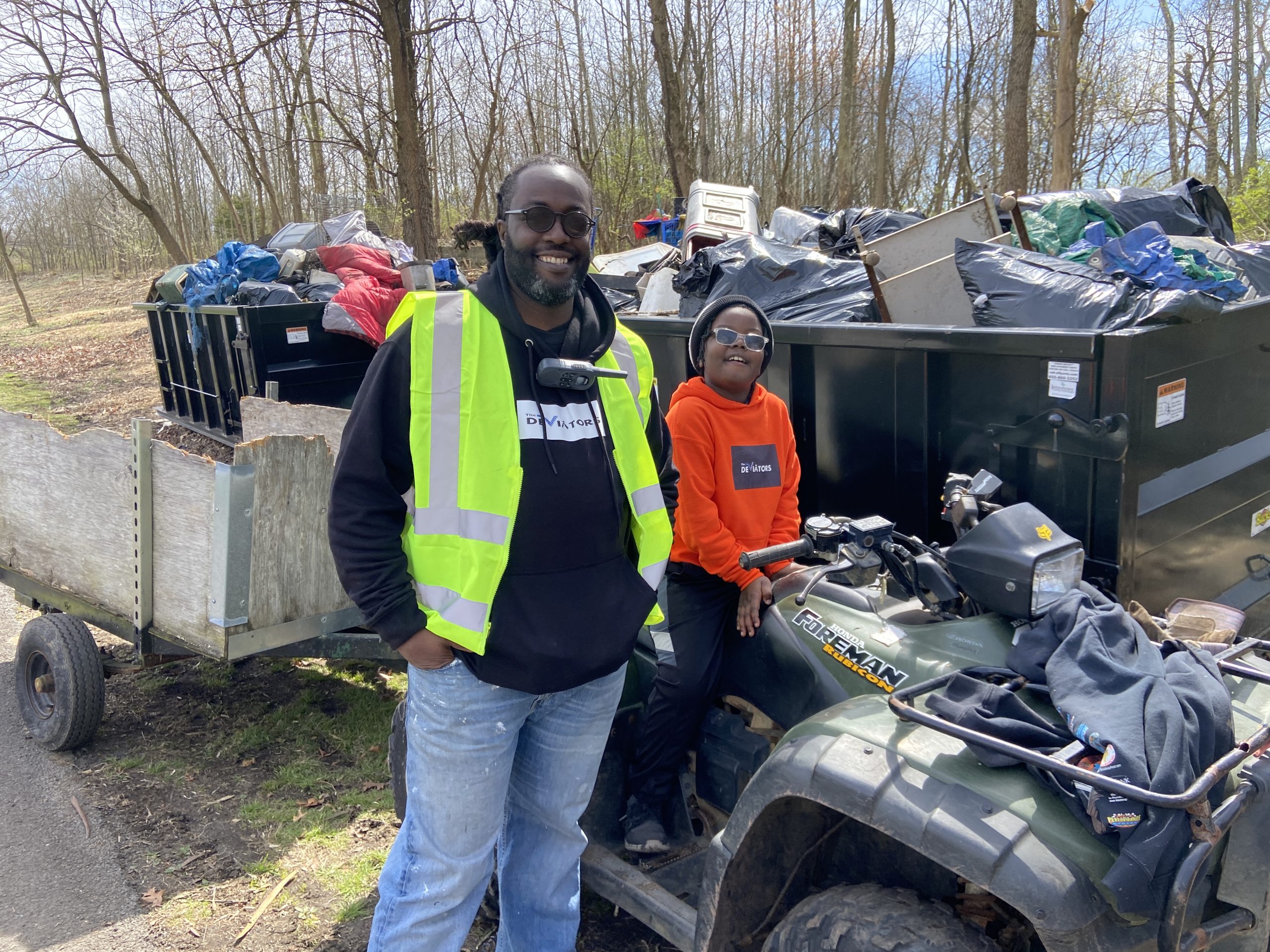 Clean-up organizer Sherman Ellis Jr., and his son Destin, who...