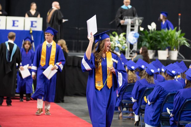 Exeter Township Senior High Class of 2024 graduate waves her diploma during commencement June 6. (Photo courtesy of Jennifer Breton, Exeter Township School District)