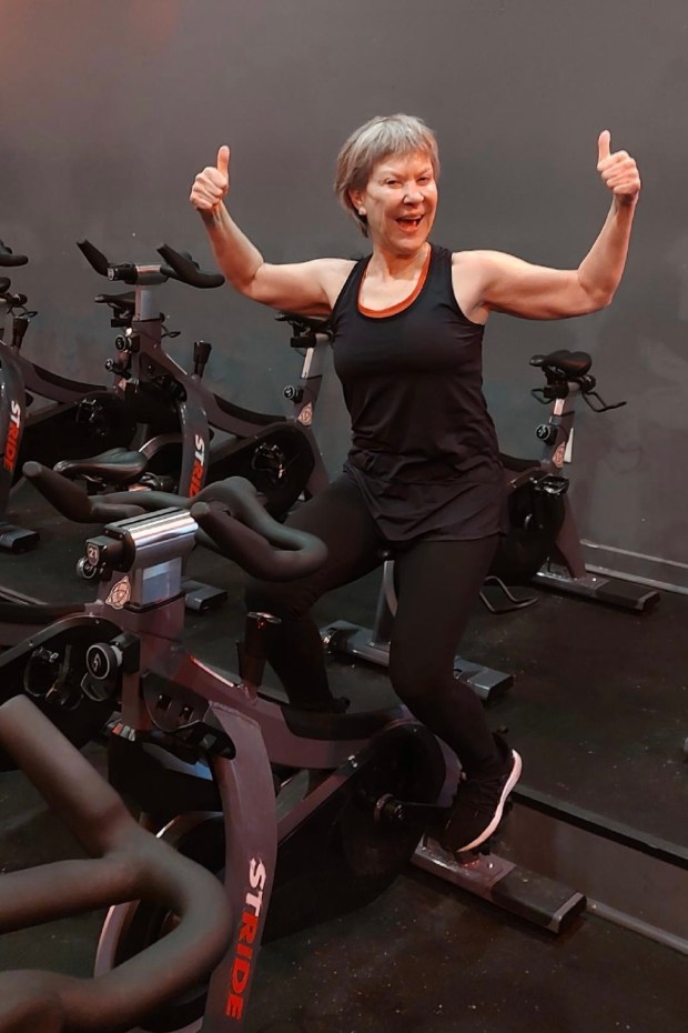 Jan Haig, a Senior Planet-sponsored athlete going strong into her late 60s, at a spin class. (Photo courtesy of Jan Haig / Senior Planet for AARP)