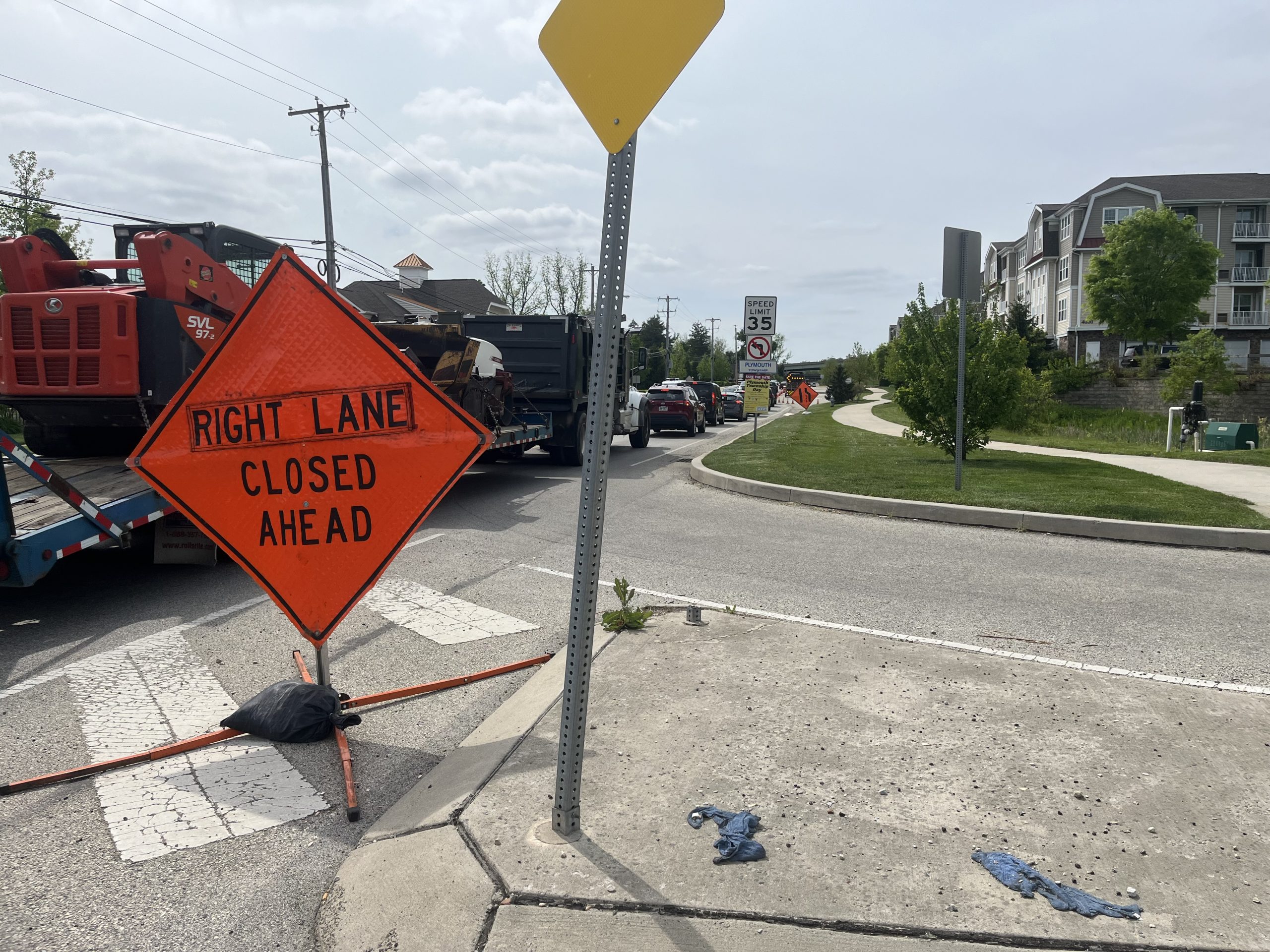 A sign is situated on the side of Plymouth Road...