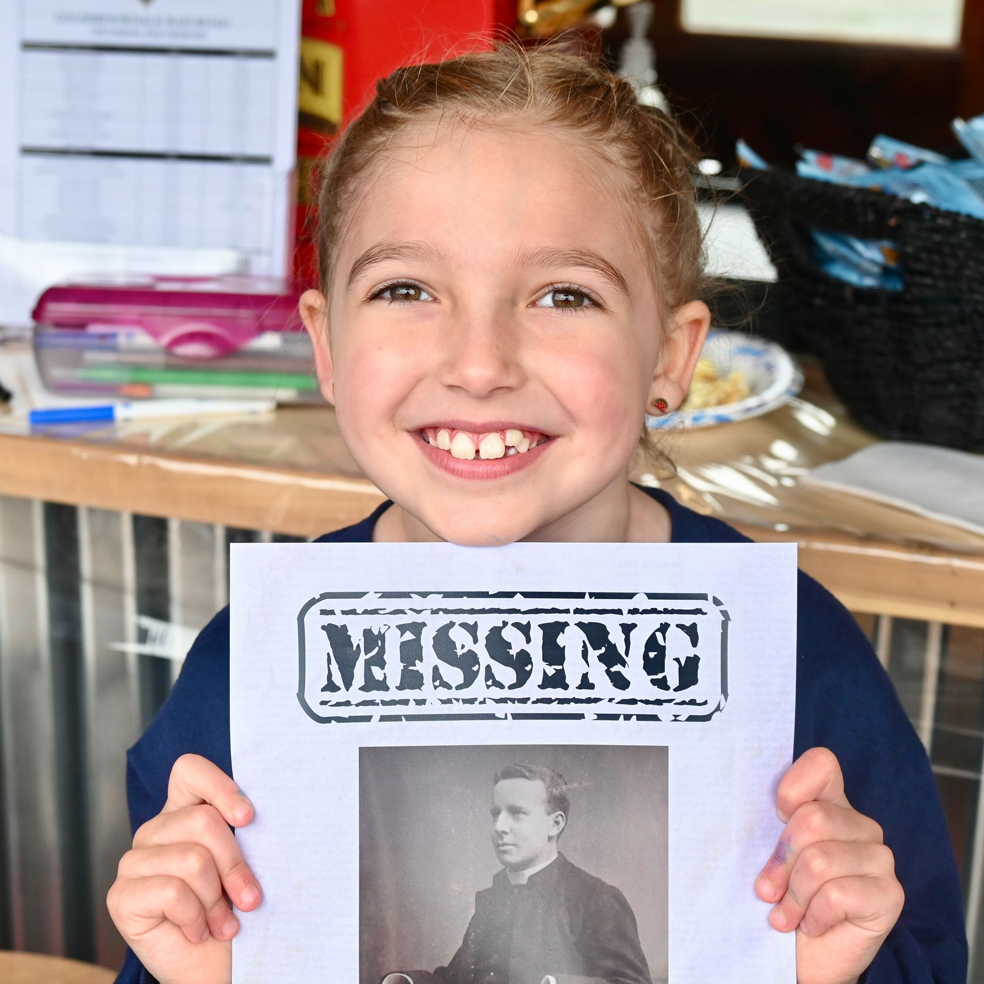 Tessa Schrack, 6, the Colebrookdale Railroad mascot, hands out missing...