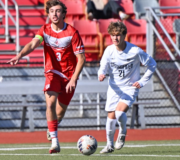 Nate Lewis (right) chases after OJR's Ryan D'Angelo in the District 1-4A quarterfinals. Lewis scored the first of three second-half goals in the Spartans' 3-0 win on October 25, 2025. (Photo by Joe Evans/JoeEvansPictures.com)