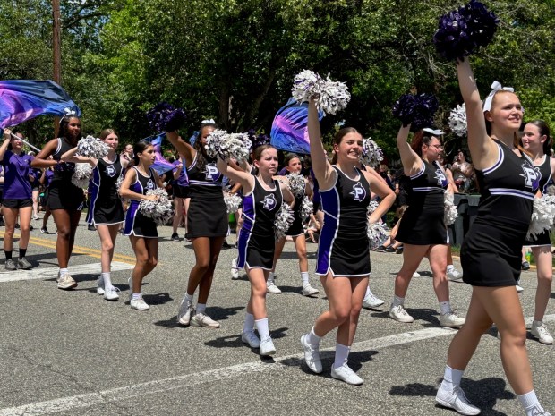 Phoenixville Area High School cheerleaders pump up the crowd during the Dogwood Parade. (Barry Taglieber - For MediaNews Group)