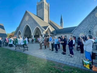 St. Teresa of Calcutta Parishioners gather for the unveiling of the St. Michael statue. (Submitted Photo)