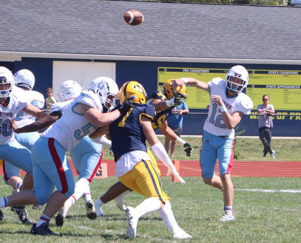 Father Judge quarterback Tyler Yerkov (12) passes the ball against Pope John Paul II at Pope John Paul II High School on Sept. 16. (Evan Wheaton - MediaNews Group)
