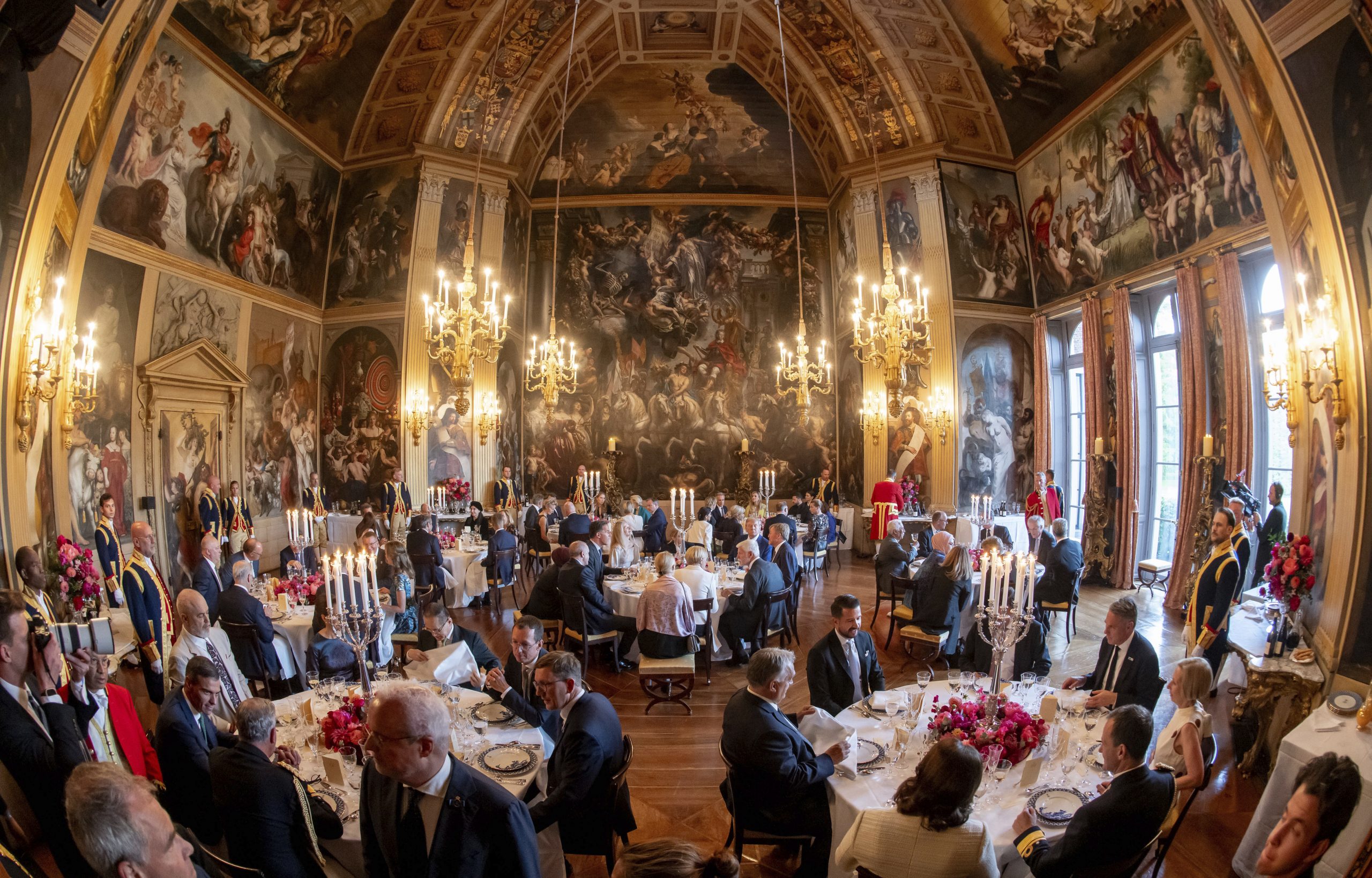 NATO heads of state and government attend a dinner at...