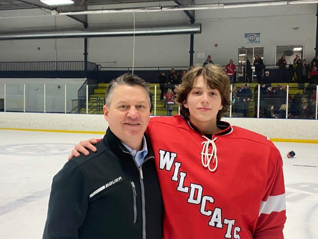 OJR coach Chuck Gorman with winning goaltender Page Faith.