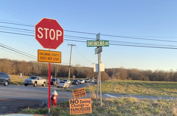 Signs opposing the development of the Parkhouse property have been posed at the intersection of Second Avenue, Black Road Road and Dreibelbis Road. (MediaNews Group File Photo)