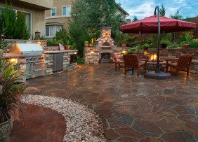 Paver patio with a fire pit, outdoor kitchen 