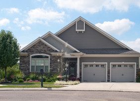 Gray house with two-car garage Gray house with two-car garage