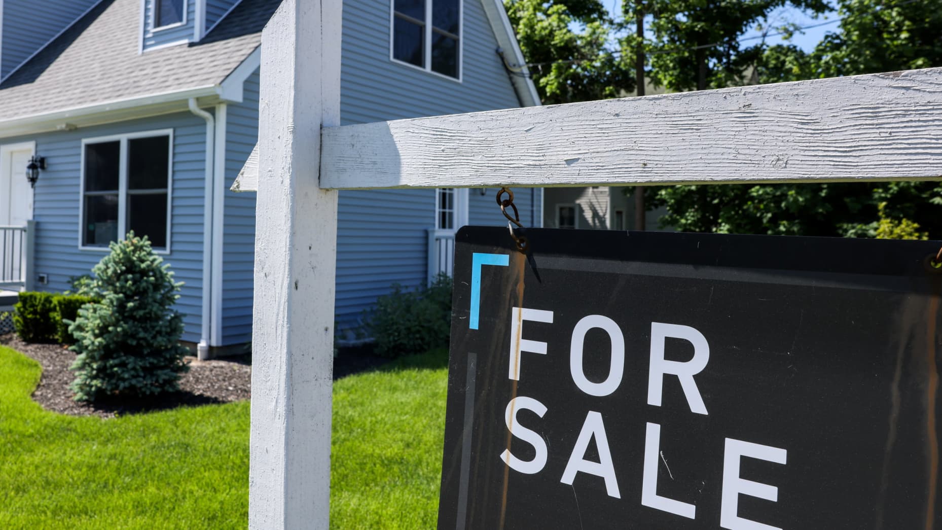 Patchogue, N.Y.: A For Sale sign hangs in front of a house in Patchogue, New York, on June 1, 2024.