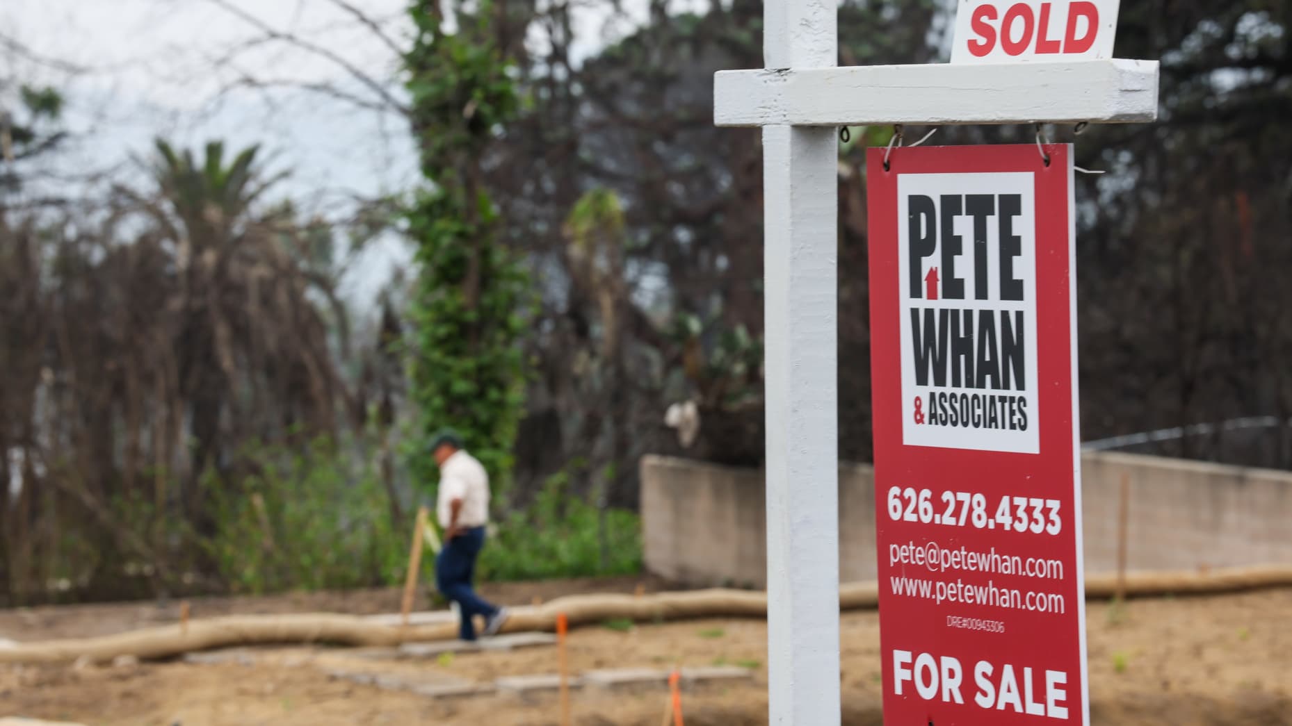Altadena, CA, Wednesday, June 4, 2025 - Victor Becerra surveys his property located next door to a recently sold property on Wapello St. Like most of his neighbors whose homes were destroyed in the Eaton Fire, Becerra is rebuilding and said he is anxious for the neighborhood to "bloom again." (Robert Gauthier/Los Angeles Times via Getty Images)