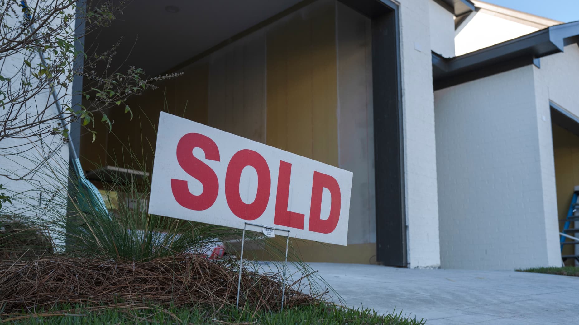 A Sold sign in front of a home under construction at the Waterways subdivision in Gulf Shores, Alabama, US, on Friday, Dec. 6, 2024. US housing starts declined in October to the slowest pace in three months as hurricanes exacerbated an easing in construction activity more generally. Photographer: Micah Green/Bloomberg via Getty Images